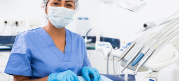 Woman dentist preparing medical tools in dental office