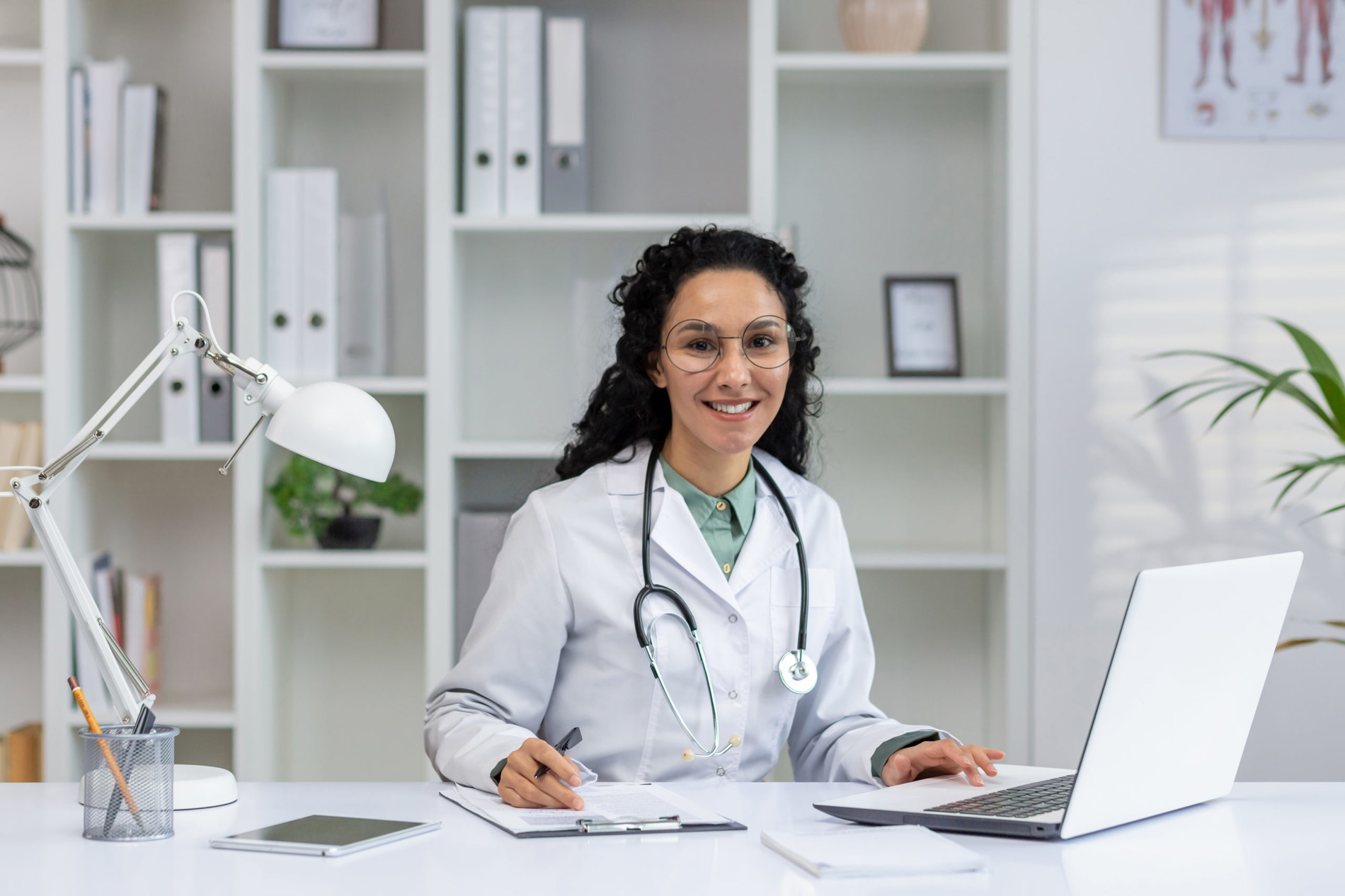 Smiling hispanic female doctor in a modern office