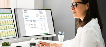 Medical account manager in office analyzing billing codes
