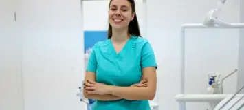 Confident patient care technician her medical office