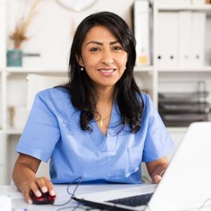 Healthcare management professional working at desk