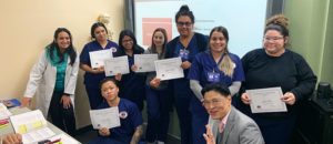 financial-aid-hero-opt Students standing together with their diplomas.