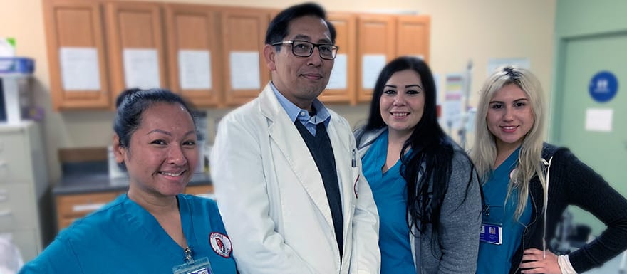 Group of students standing with instructor.