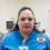 Iliana R., a Healthcare Career College graduate, wearing scrubs with a school patch in a clinical setting